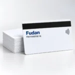 Illustrative Fudan FM11HIRF08 1K contactless card beside a stack of white cards