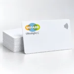 Illustrative MIFARE Ultralight C contactless card beside a stack of white cards