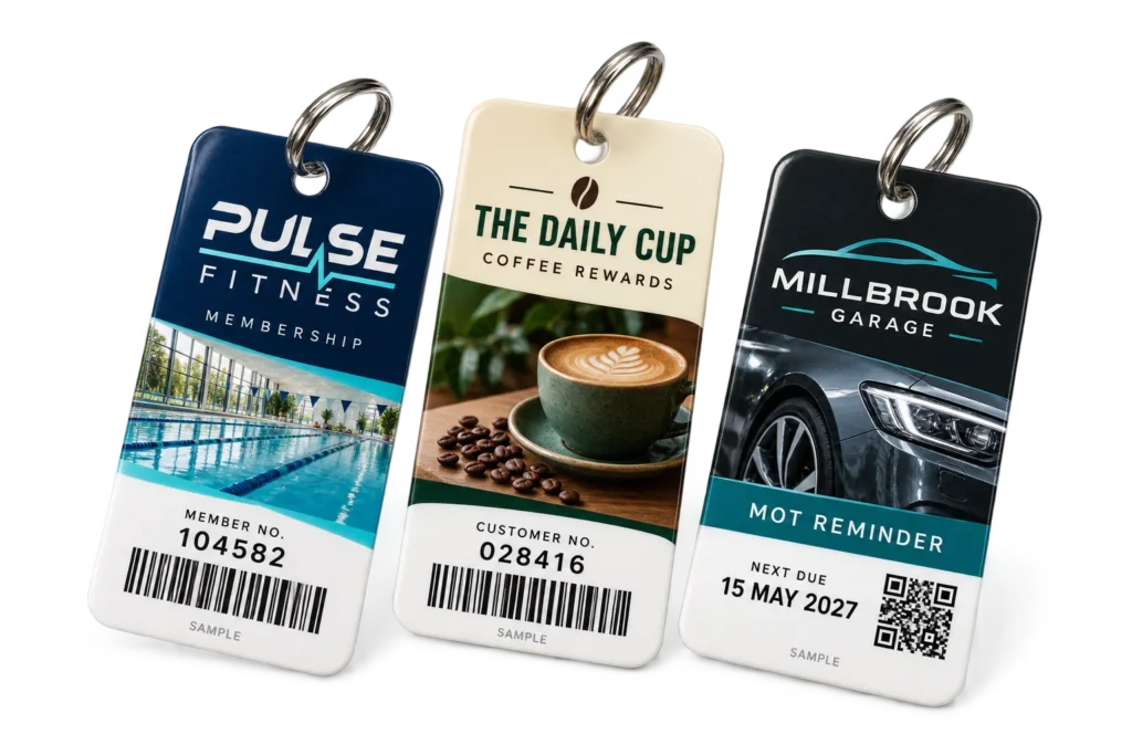 Illustrative printed plastic key tags for fitness membership, coffee loyalty and MOT reminders