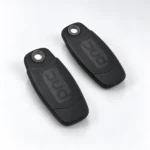 Two black PAC proximity tokens without clips