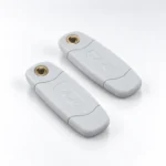 Two white PAC KeyPAC proximity fobs